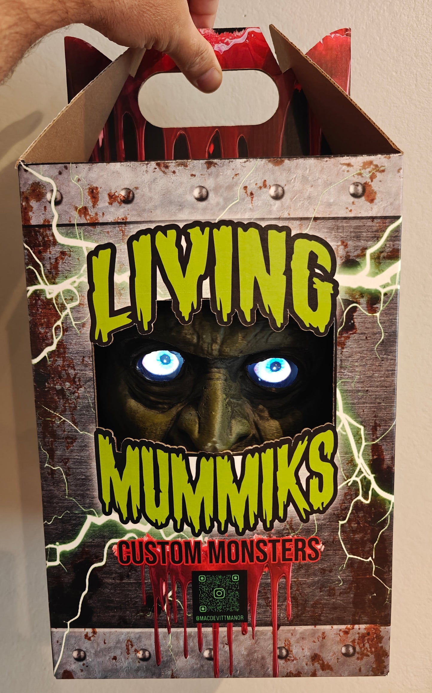 Living Mummiks custom monsters packaging with a hand holding the box.
Frankenstein Monster 3D printed Bust with Living Mummiks Display Box and Digital eyes kit installed. Halloween, Horror Display.