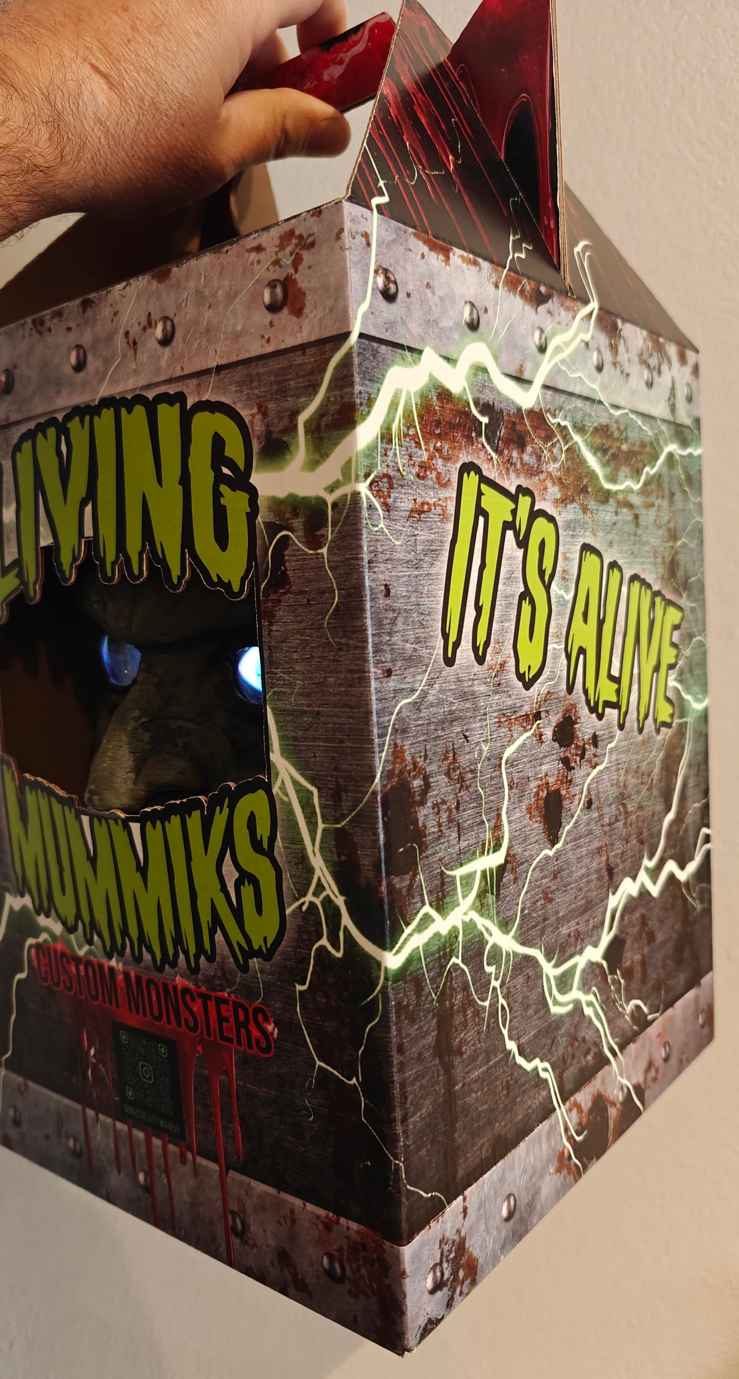 Living Mummys box with glowing eyes and 'It's Alive' text on a plain
Frankenstein Monster 3D printed Bust with Living Mummiks Display Box and Digital eyes kit installed. Halloween, Horror Display.background