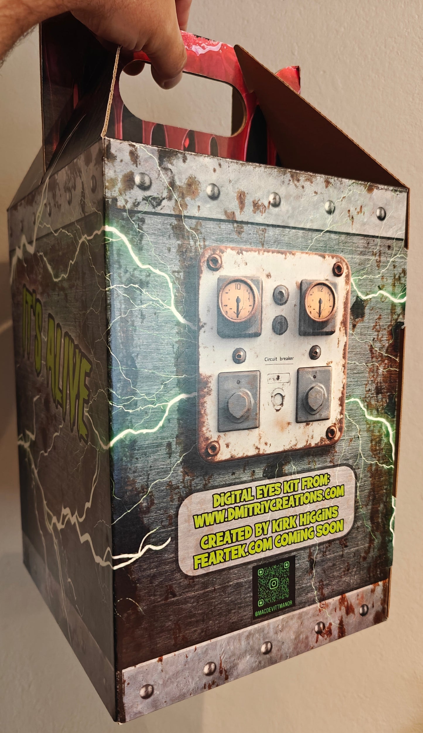 Box with a steampunk design held by a hand against a plain background, Frankenstein Monster 3D printed Bust with Living Mummiks Display Box and Digital eyes kit installed. Halloween, Horror Display.