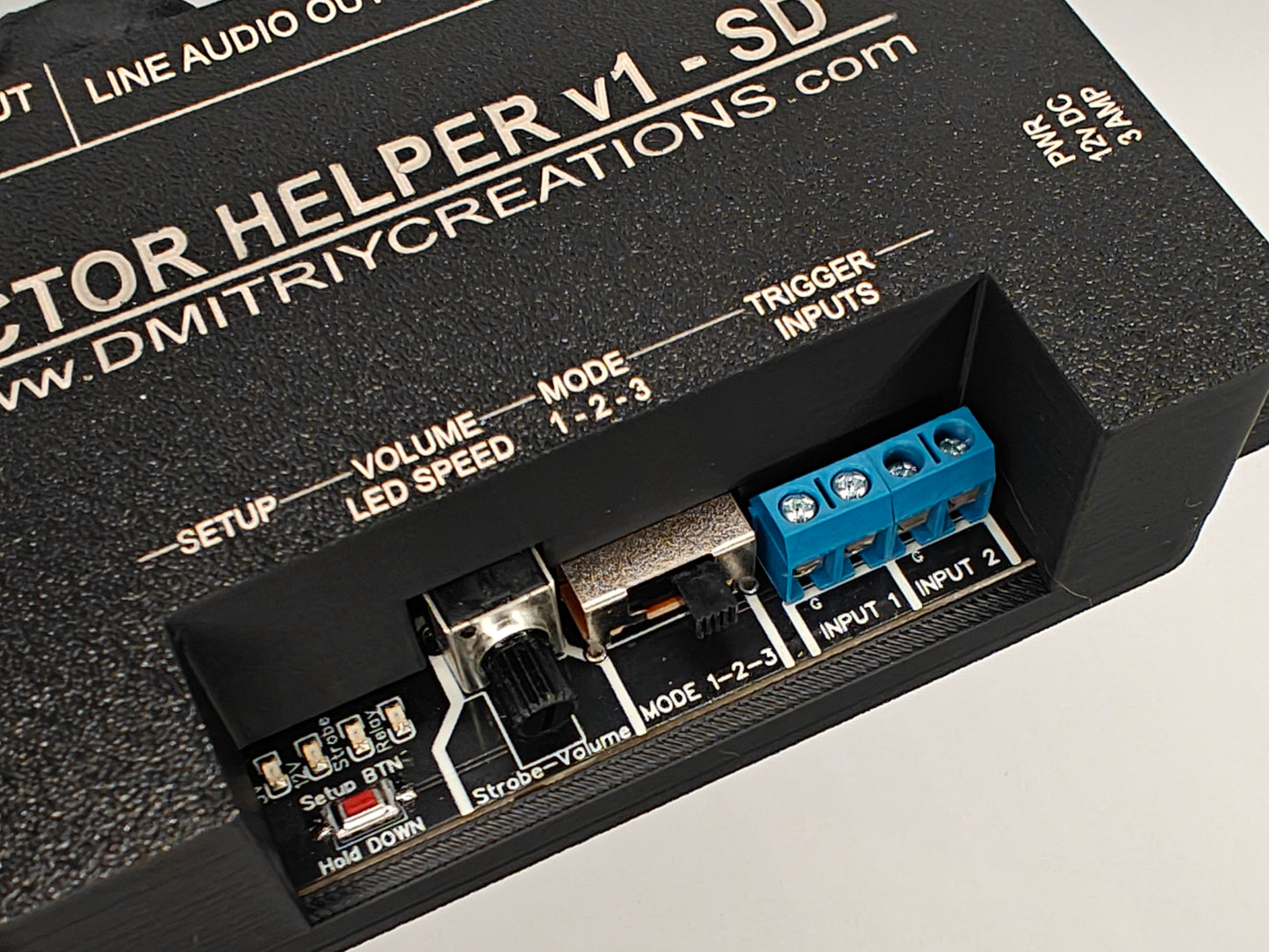 Actor Helper controller with 128mb SD Card included for Scare Actors, front control view showing Setup button, 4 Status LED, Volume or settings control pot, Mode switch 1,2, or 3, 2 separate inputs for triggers 1 and trigger 2