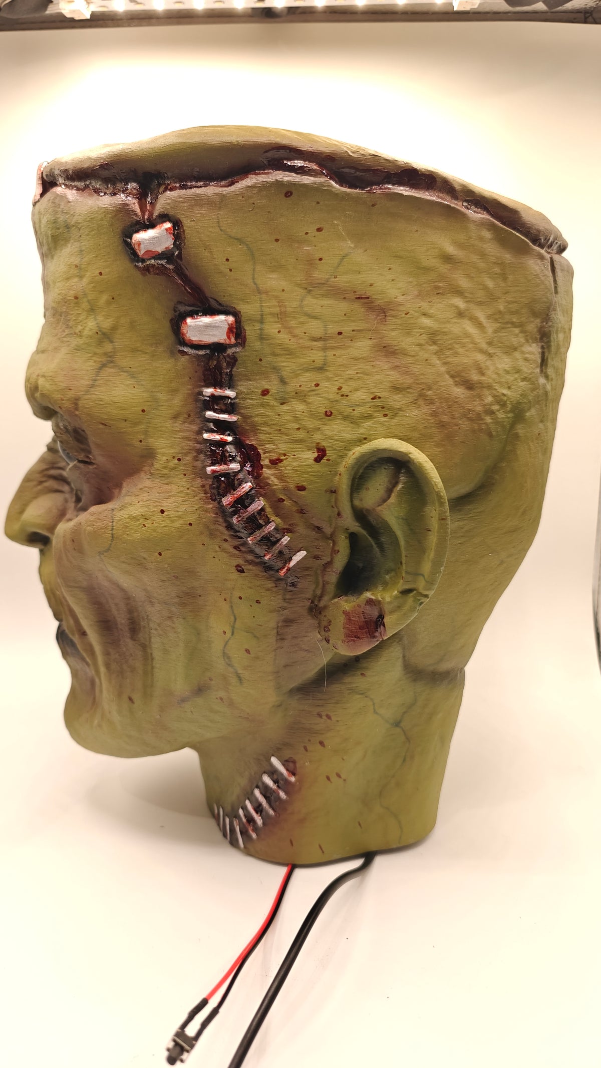 Frankenstein Bust 1, opposite side profile with scar detailing and external switch lead.