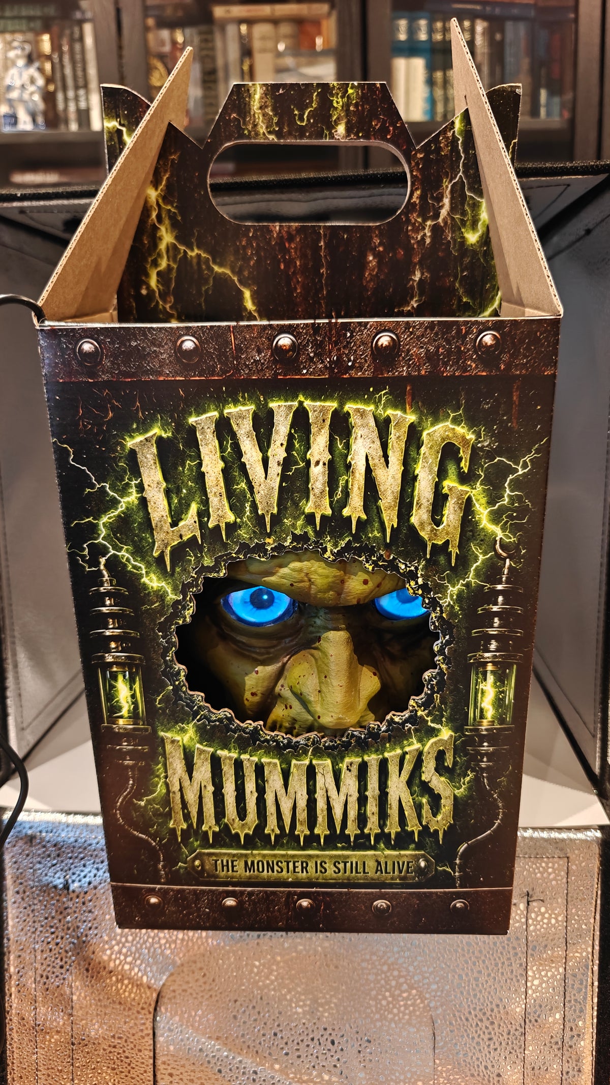 Included Living Mummiks carrying/demo-case design, front viewing opening with a bust demonstrating the digital eyes.
