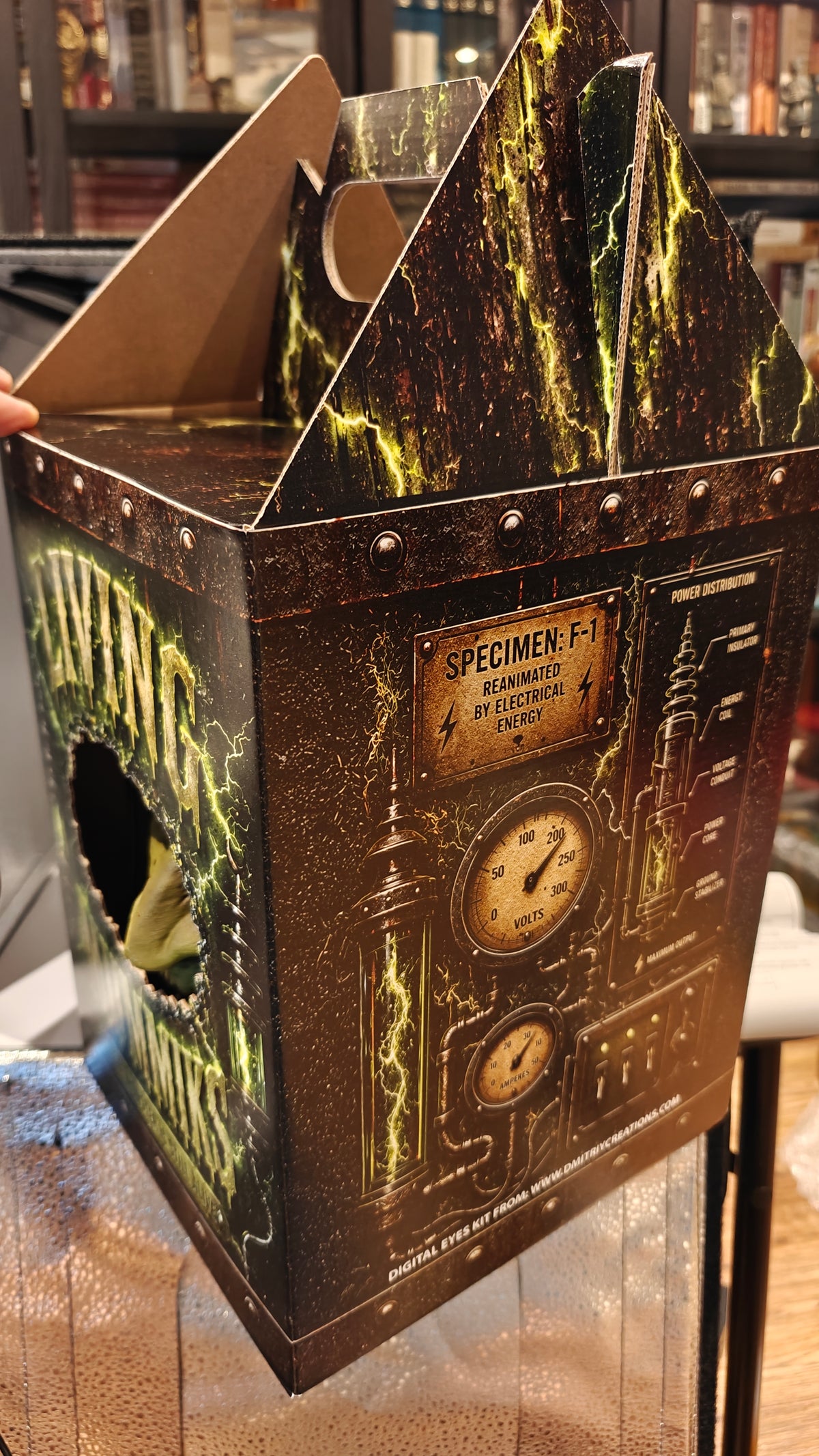 Shared Living Mummiks case design with carry-handle panels and printed laboratory gauges.