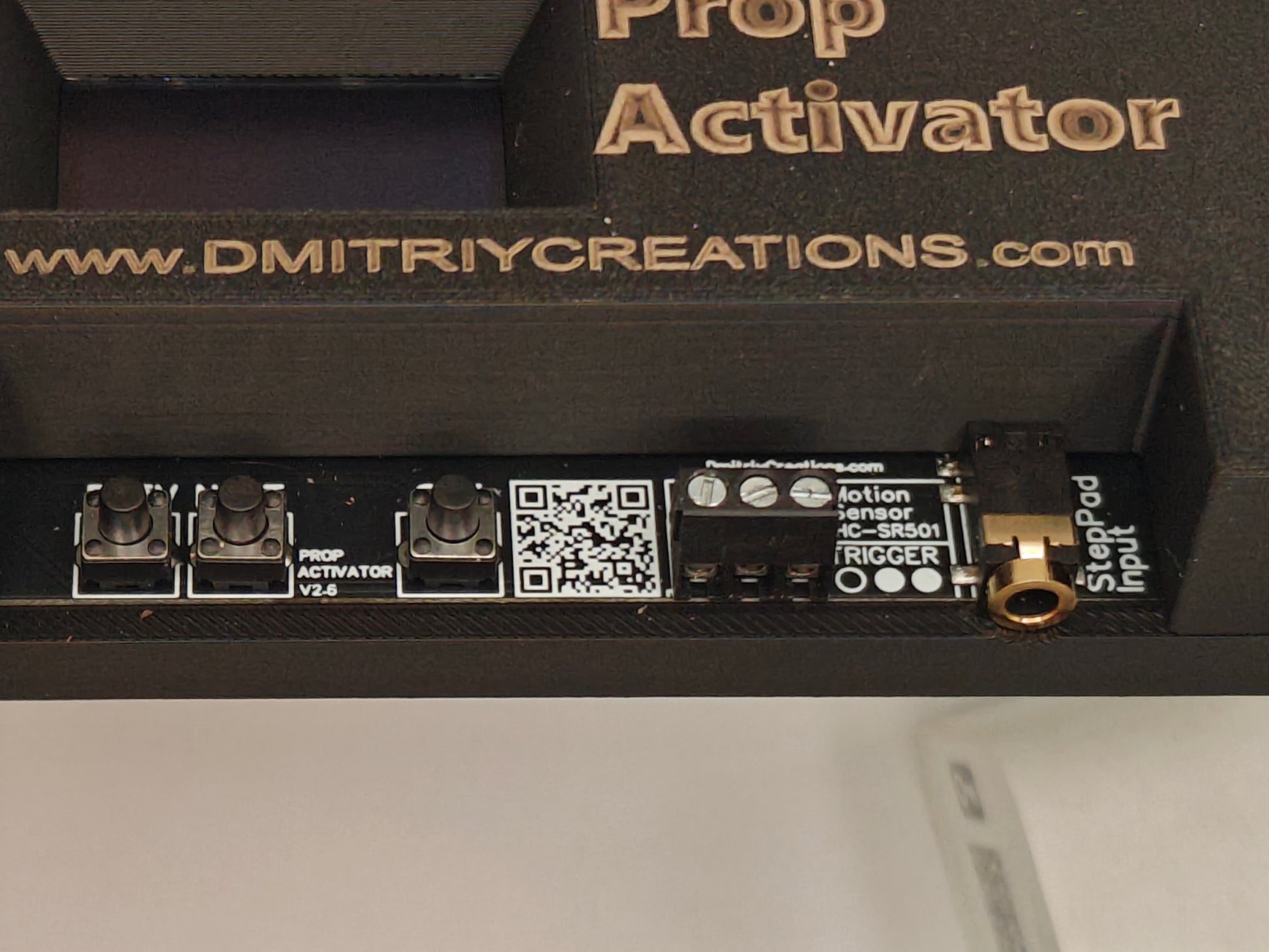 Close-up of a device labeled 'Prop Activator' showing control navigation buttons and rigger input