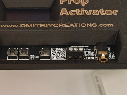 Close-up of a device labeled 'Prop Activator' showing control navigation buttons and rigger input